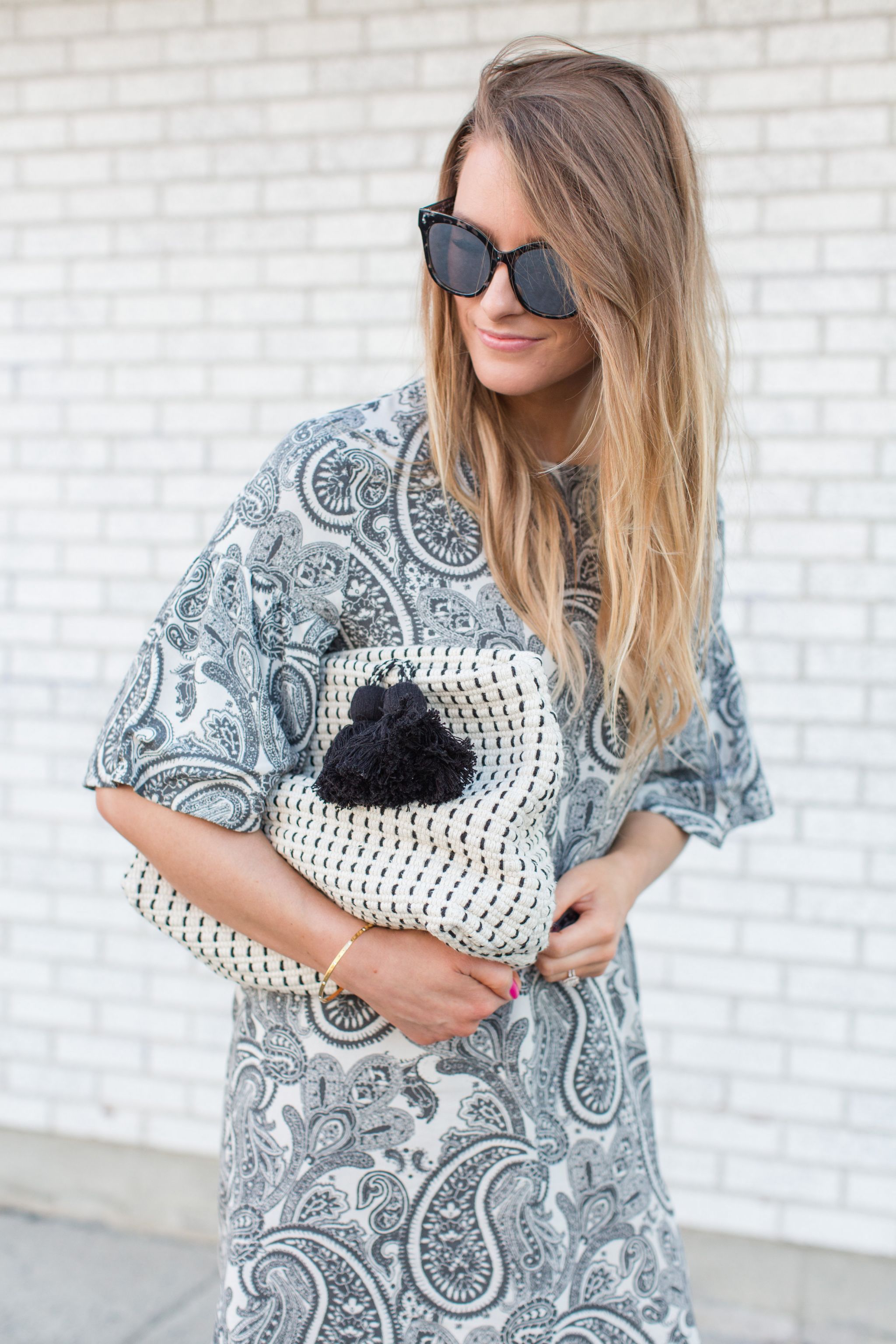 1 person, girl wearing paisley dress, grey sunglasses