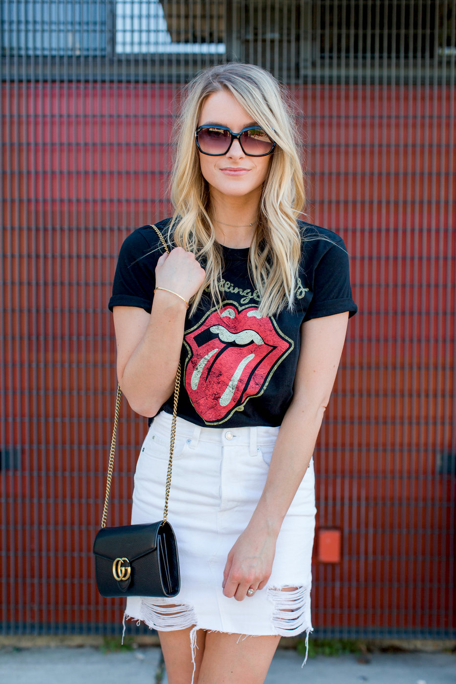 1 person, girl wearing Rolling Stones t-shirt and white denim skirt