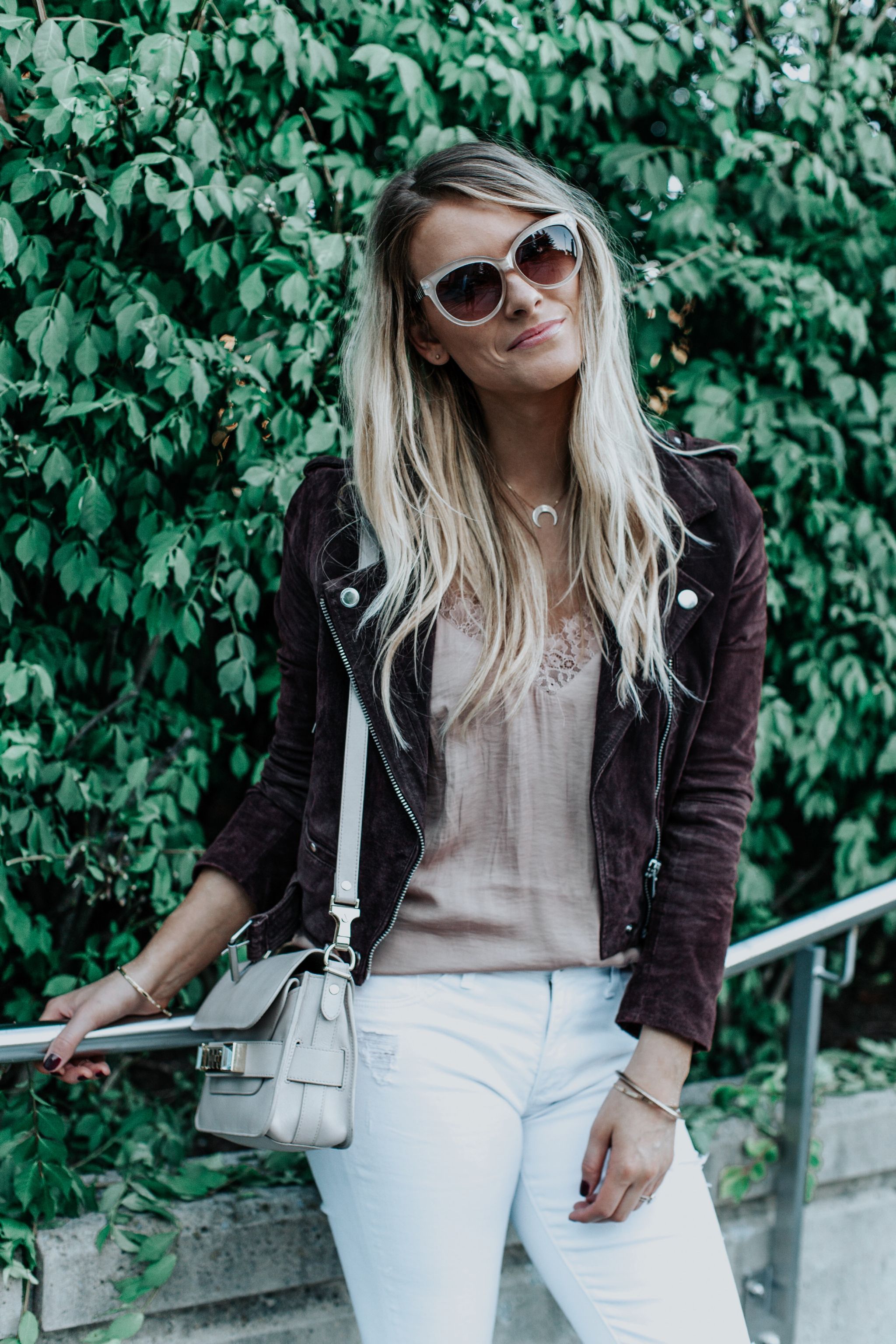1 person, girl wearing blush cami and suede jacket