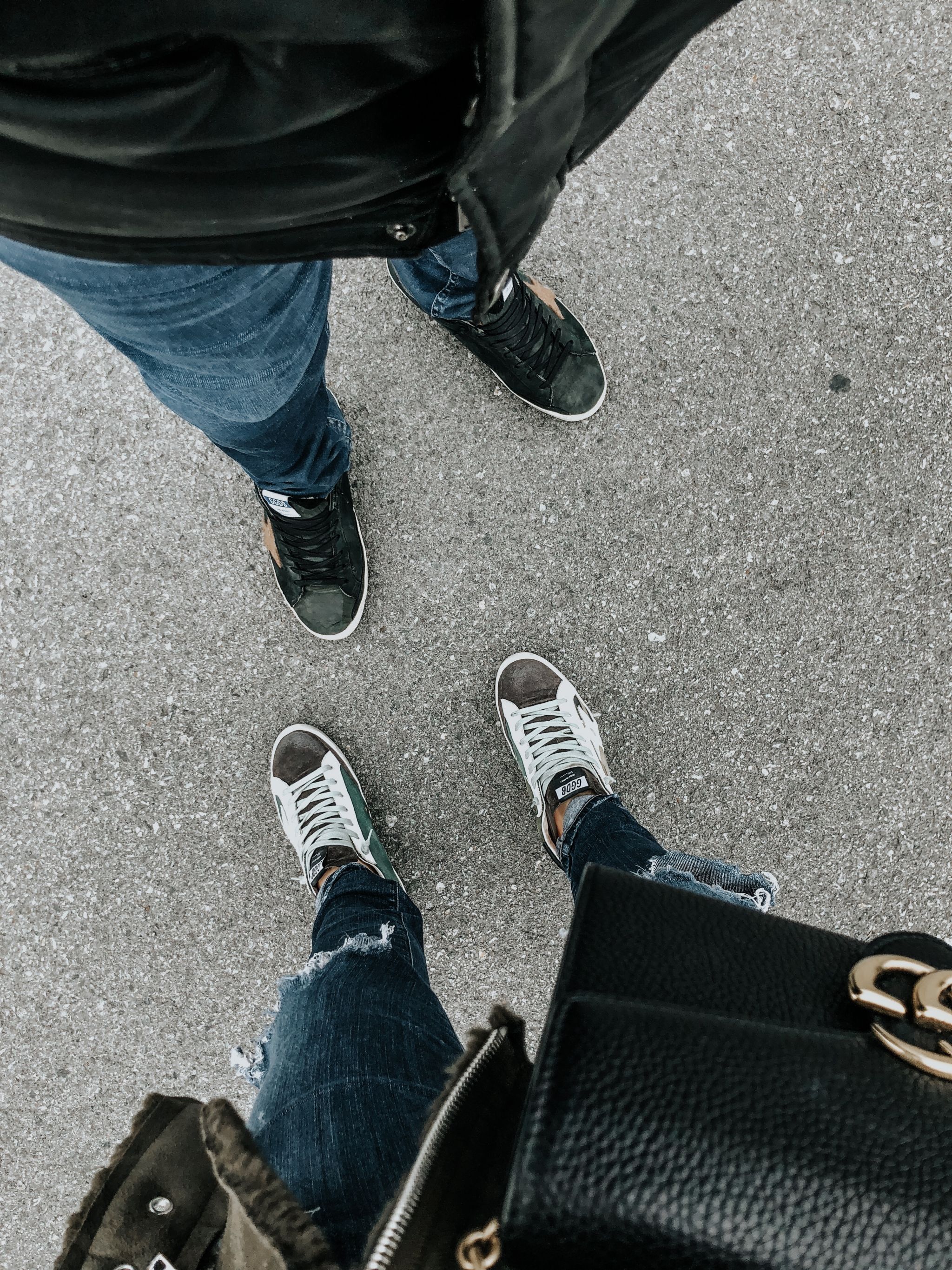 2 people, from where I stand, matching golden goose shoes