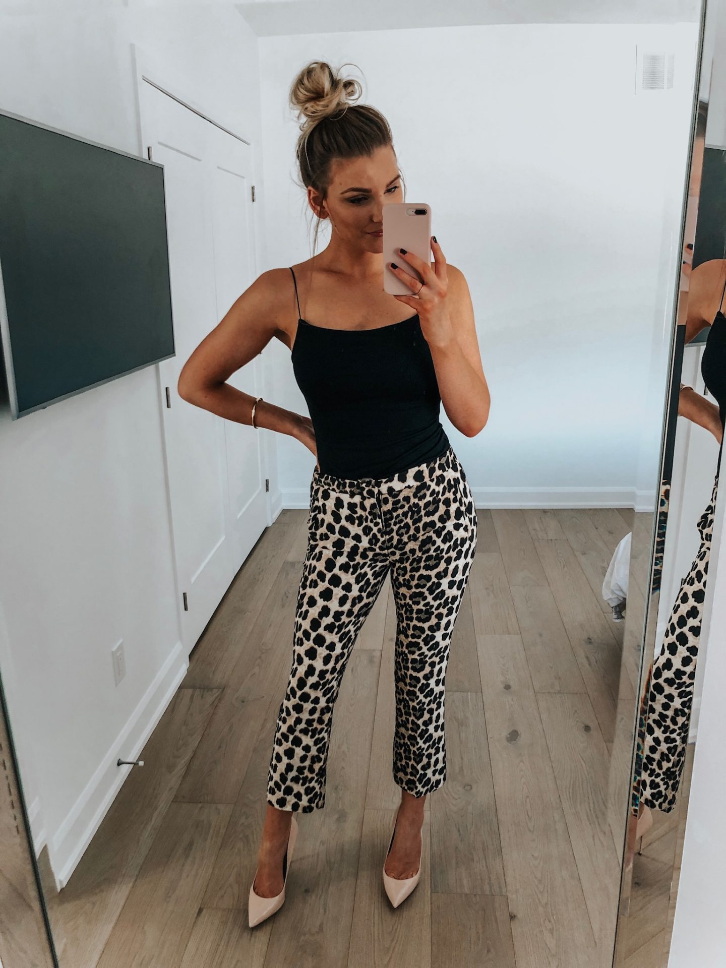 fashion blogger selfie in leopard pants and black top